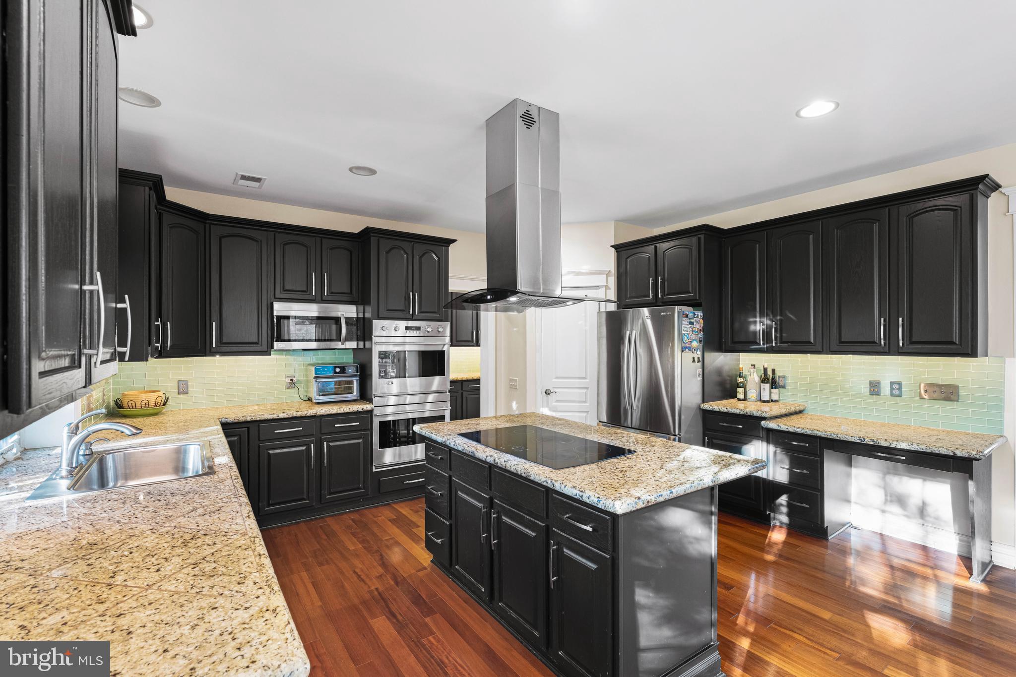 6 Howell Court Princeton Junction, NJ 08550 - Photo 30 of 81 a kitchen with stainless steel appliances granite countertop a sink stove and refrigerator