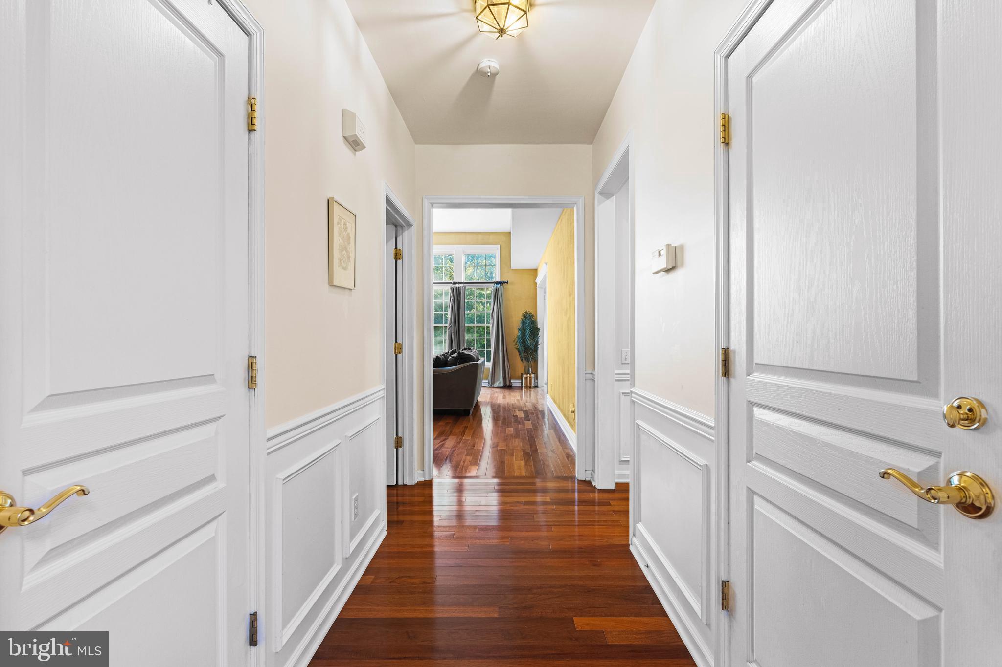 6 Howell Court Princeton Junction, NJ 08550 - Photo 43 of 81 a view of a hallway with wooden floor and staircase
