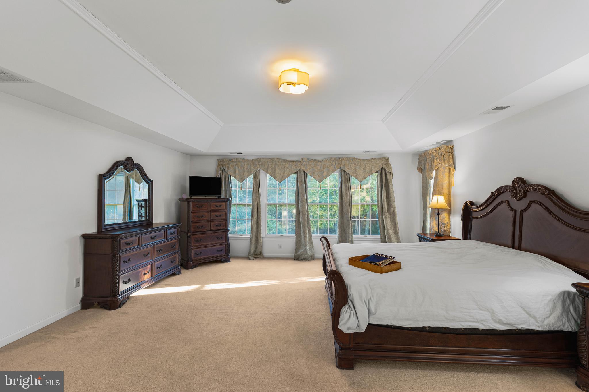 6 Howell Court Princeton Junction, NJ 08550 - Photo 50 of 81 a spacious bedroom with a bed and dresser with outer view