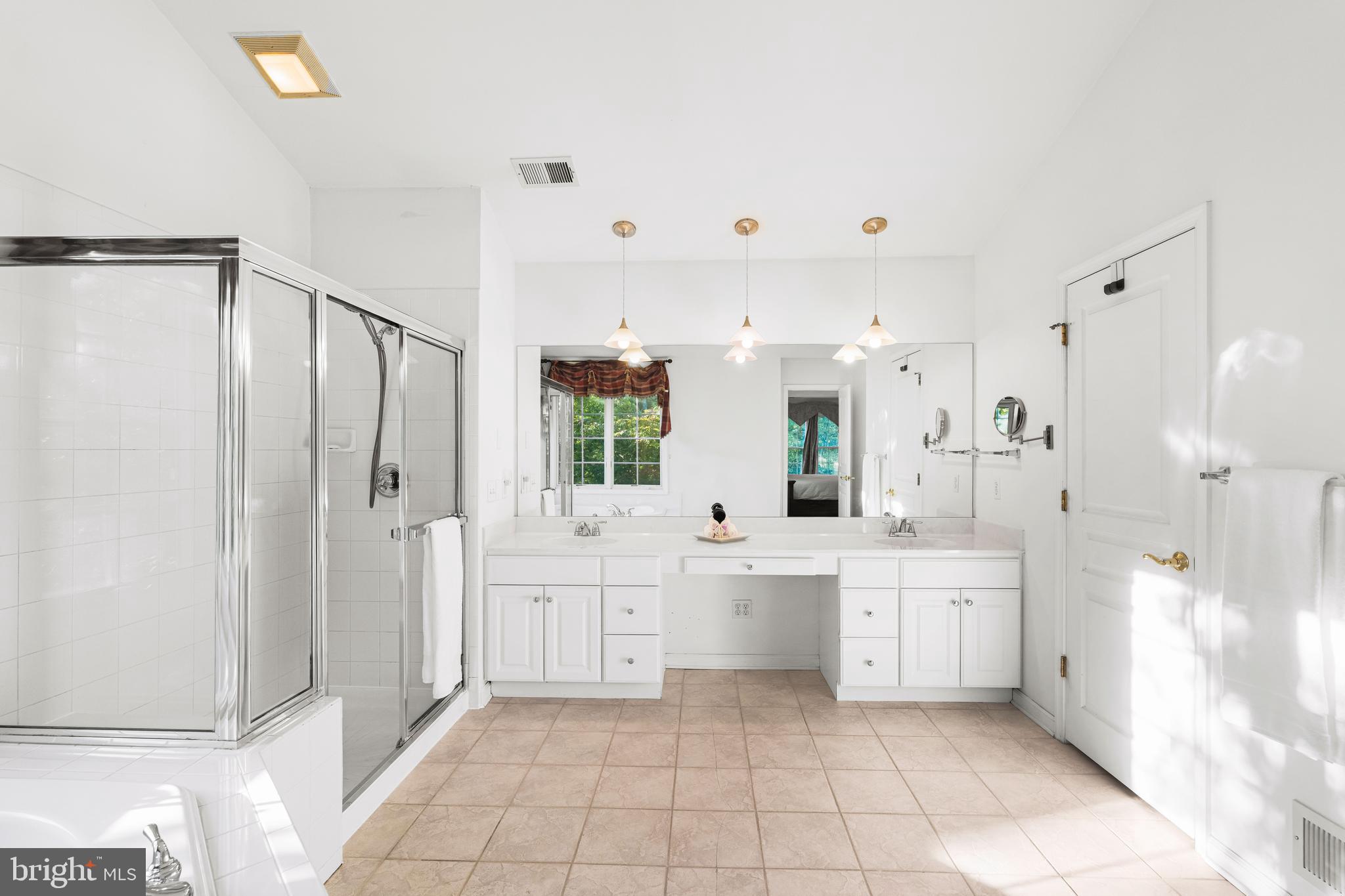 6 Howell Court Princeton Junction, NJ 08550 - Photo 54 of 81 a large white bathroom with a double vanity sink a large mirror and a bathtub