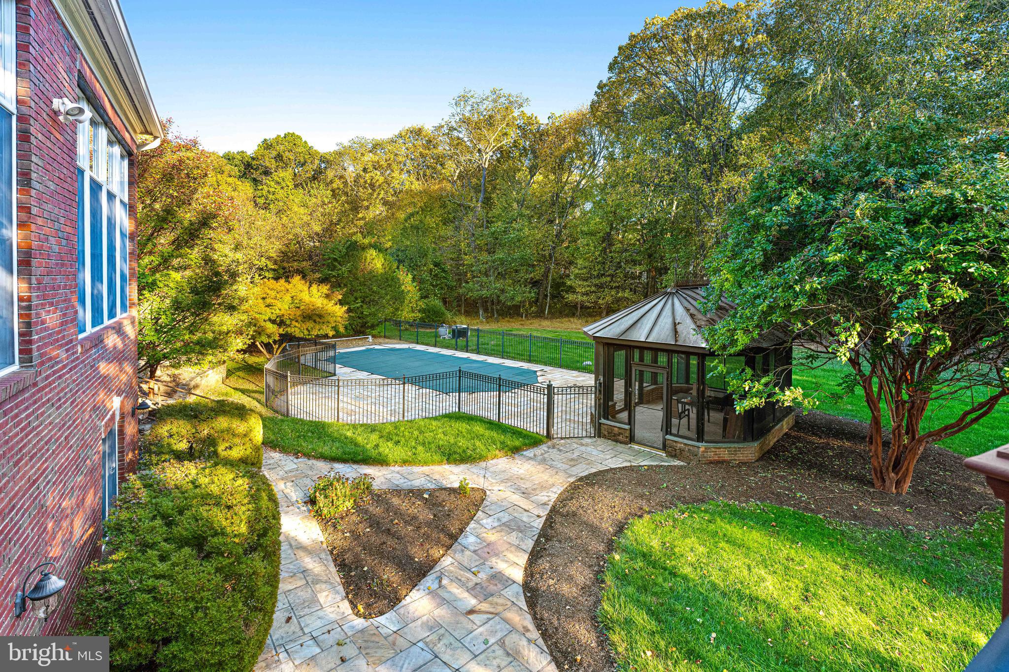6 Howell Court Princeton Junction, NJ 08550 - Photo 6 of 81 a view of a patio with table and chairs potted plants and large tree