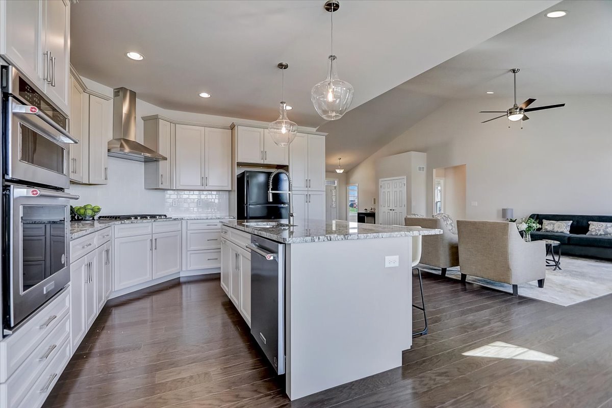 39-w553 Carl Sandburg Road St. Charles, IL 60175 - Photo 12 of 49 a kitchen with white cabinets and stainless steel appliances