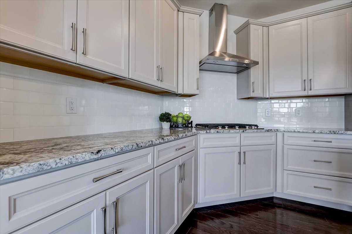 39-w553 Carl Sandburg Road St. Charles, IL 60175 - Photo 13 of 49 a kitchen with stainless steel appliances granite countertop white cabinets and a stove