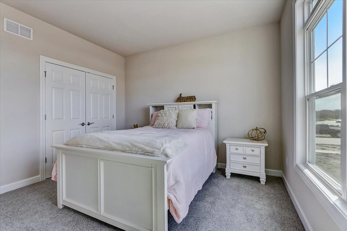 39-w553 Carl Sandburg Road St. Charles, IL 60175 - Photo 27 of 49 a bedroom with a bed and a window