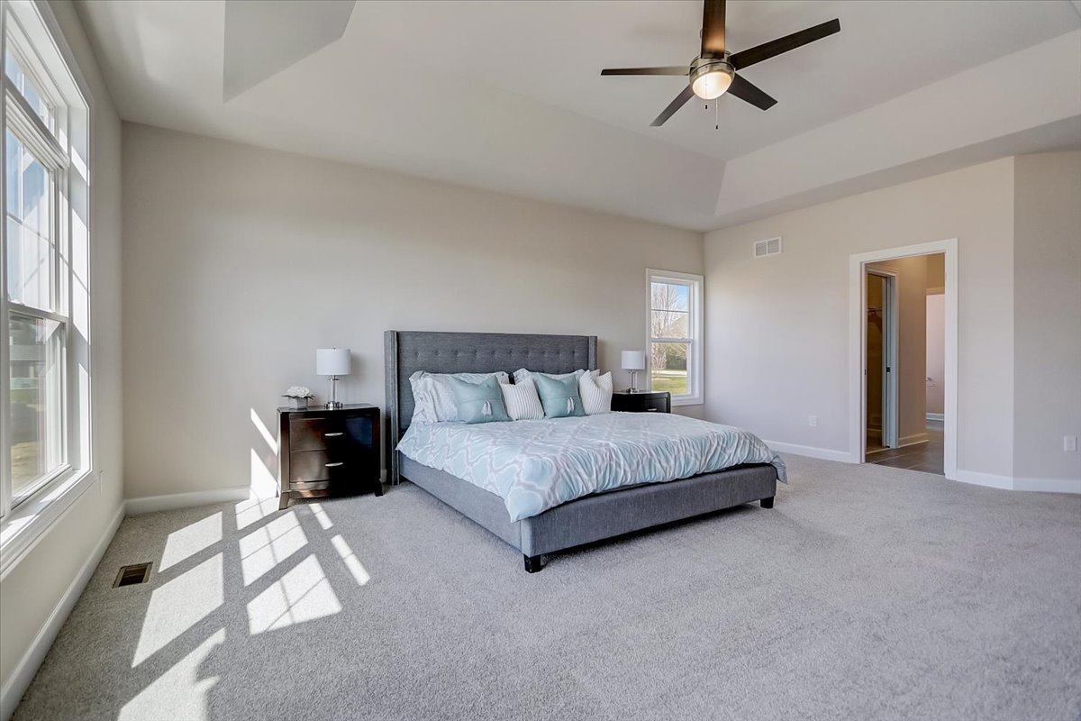 39-w553 Carl Sandburg Road St. Charles, IL 60175 - Photo 34 of 49 a spacious bedroom with a bed and a window