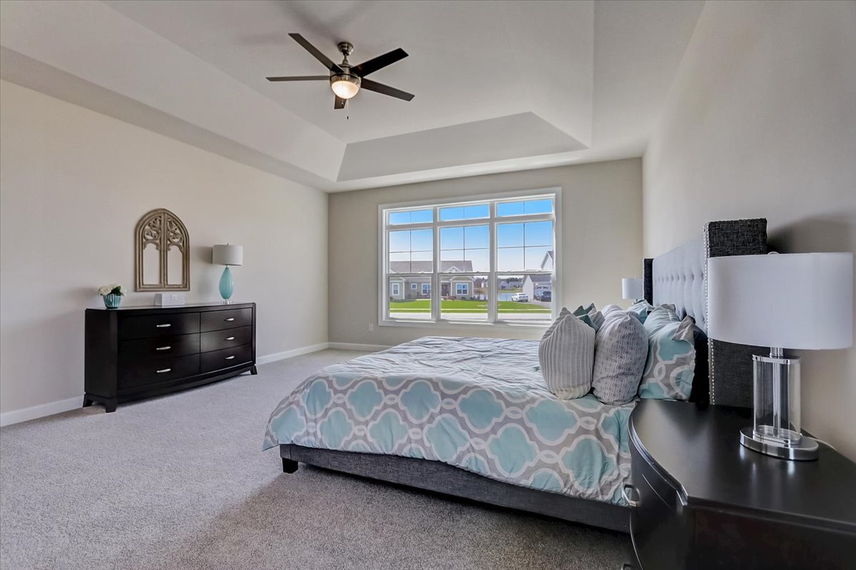 39-w553 Carl Sandburg Road St. Charles, IL 60175 - Photo 36 of 49 a bedroom with a bed and a chandelier