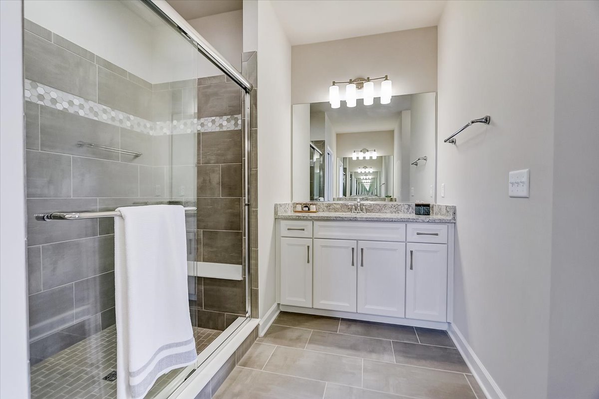 39-w553 Carl Sandburg Road St. Charles, IL 60175 - Photo 40 of 49 a bathroom with a double vanity sink and mirror