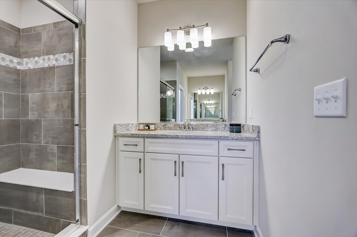 39-w553 Carl Sandburg Road St. Charles, IL 60175 - Photo 41 of 49 a bathroom with a double vanity sink and a mirror