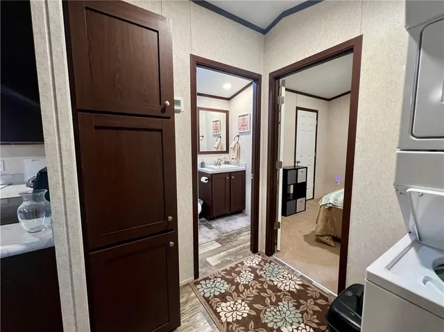 a kitchen with stainless steel appliances granite countertop a refrigerator and a stove