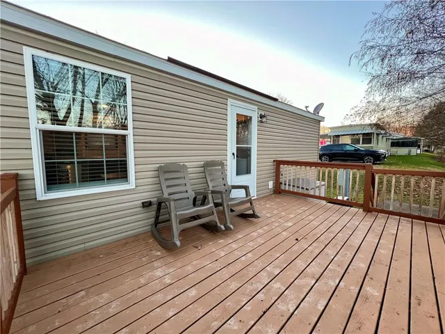 a view of a two chairs on the deck