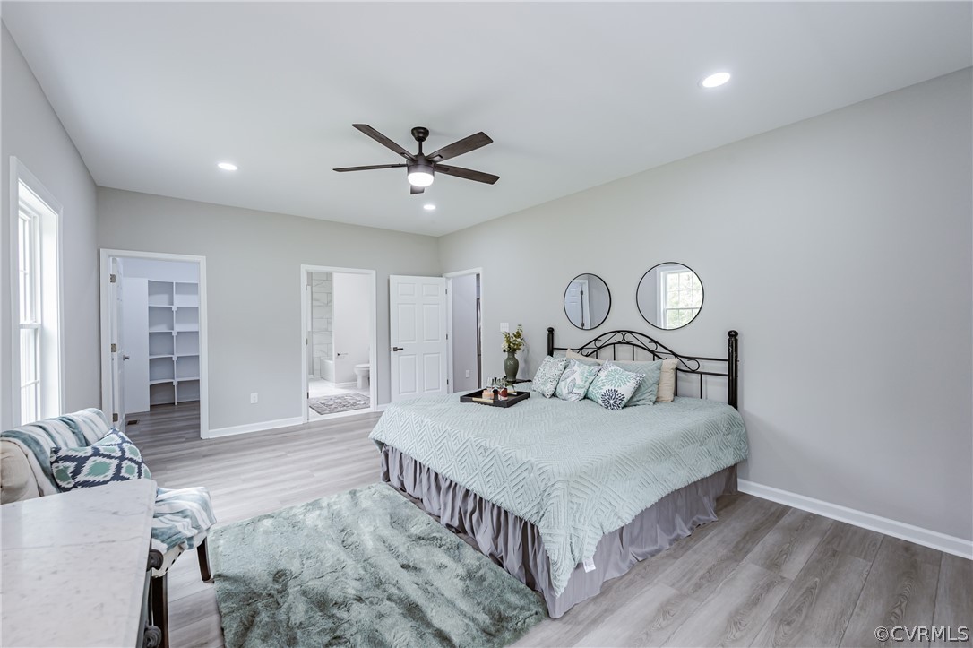 3163 Sandy Hook Road Sandy Hook, VA 23153 - Photo 12 of 37 a bedroom with furniture and a chandelier