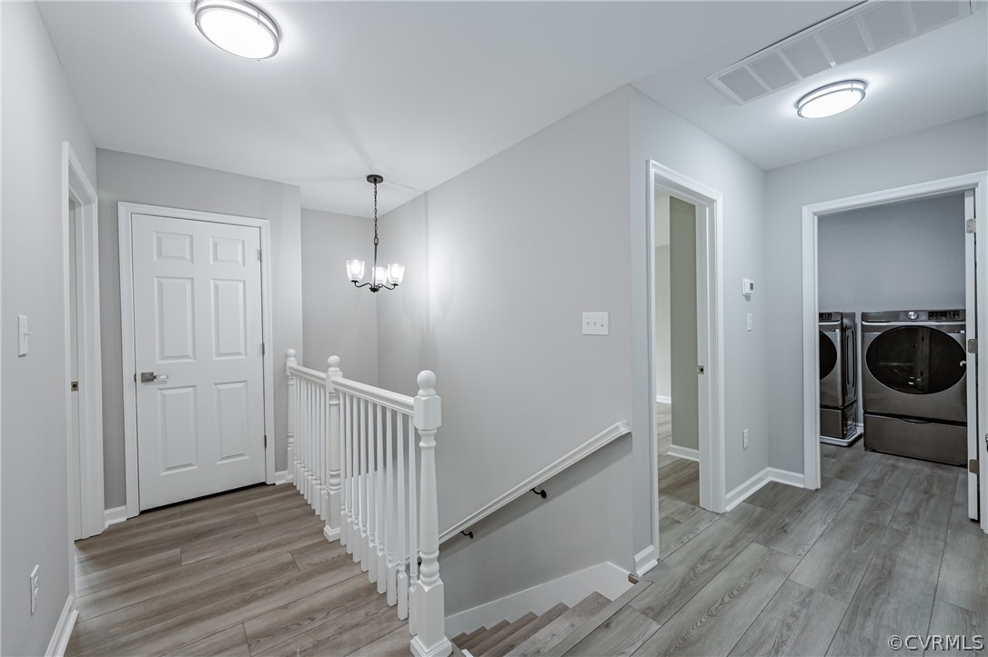 3163 Sandy Hook Road Sandy Hook, VA 23153 - Photo 18 of 37 a view of a hallway with wooden floor and a sink