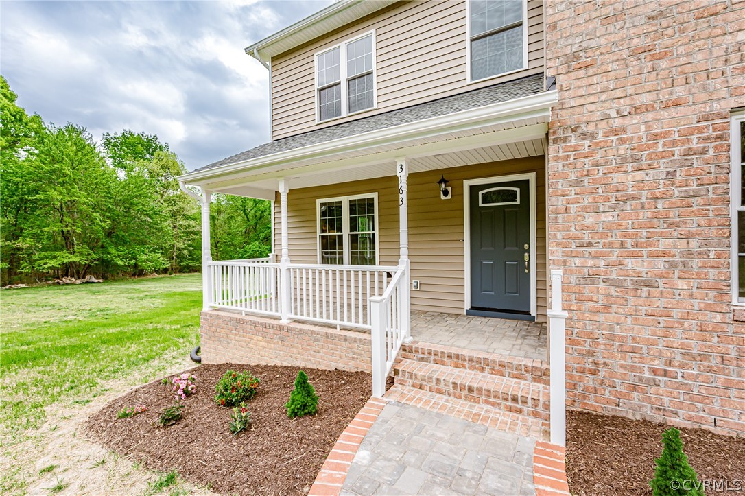 3163 Sandy Hook Road Sandy Hook, VA 23153 - Photo 2 of 37 a house with a garden space