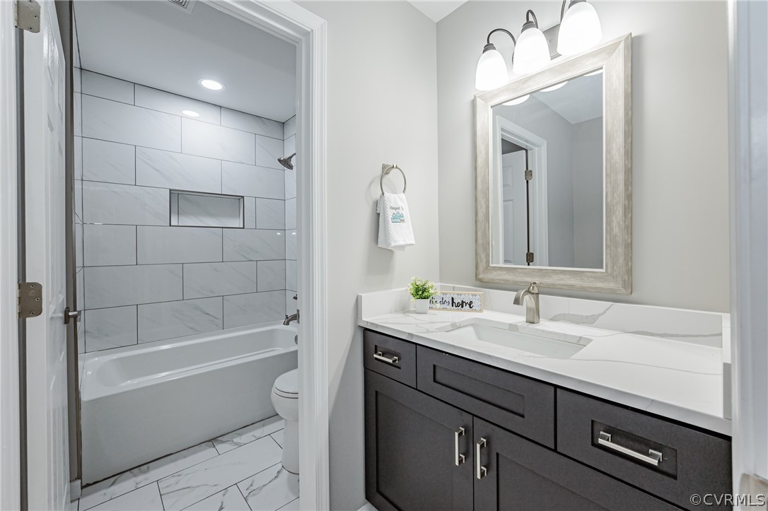 3163 Sandy Hook Road Sandy Hook, VA 23153 - Photo 21 of 37 a bathroom with a sink a toilet and shower