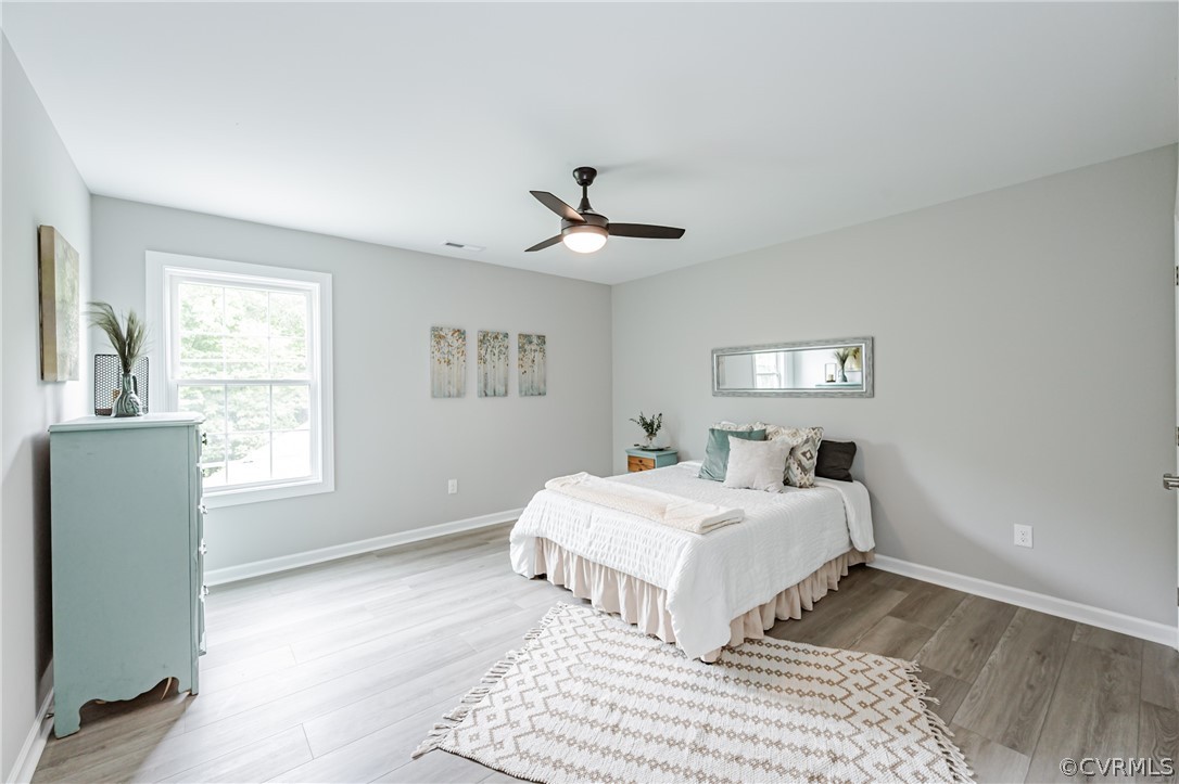 3163 Sandy Hook Road Sandy Hook, VA 23153 - Photo 23 of 37 a bedroom with a bed and a window