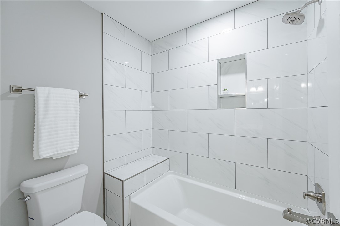 3163 Sandy Hook Road Sandy Hook, VA 23153 - Photo 26 of 37 a bathroom with a toilet and bathtub