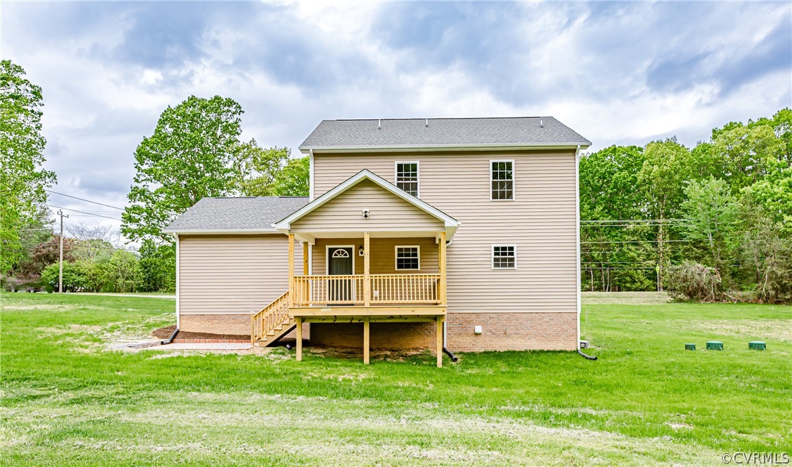 3163 Sandy Hook Road Sandy Hook, VA 23153 - Photo 34 of 37 a front view of a house with a yard