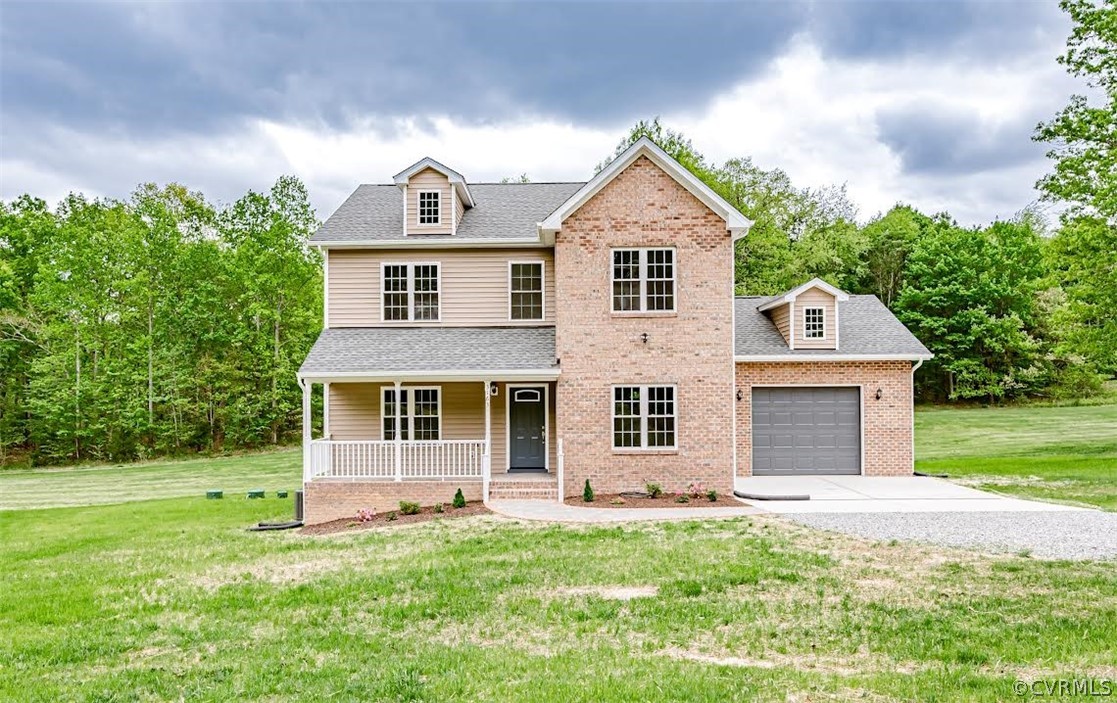 3163 Sandy Hook Road Sandy Hook, VA 23153 - Photo 36 of 37 a front view of a house with a yard