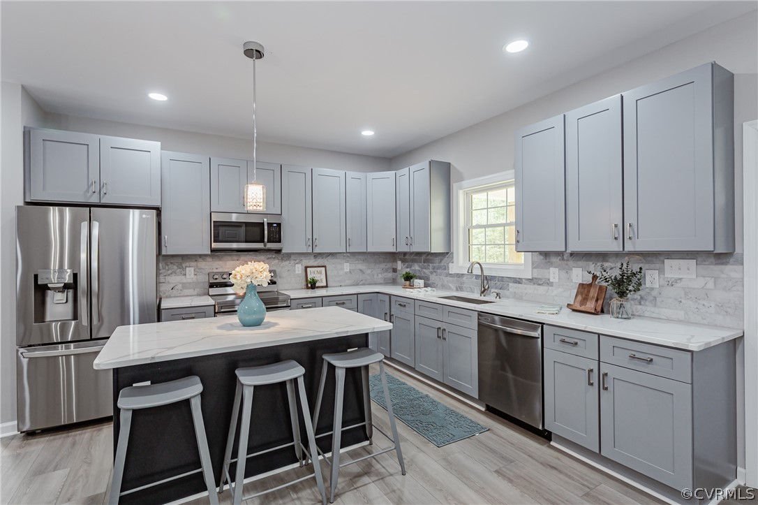 3163 Sandy Hook Road Sandy Hook, VA 23153 - Photo 7 of 37 a kitchen with white cabinets stainless steel appliances and sink