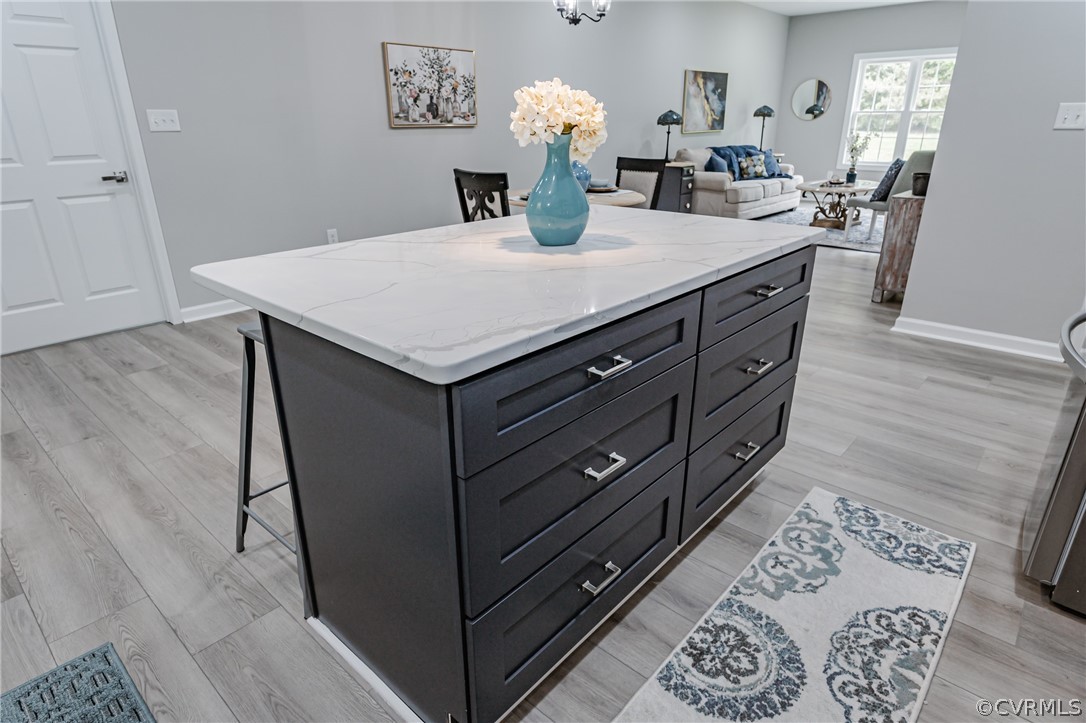 3163 Sandy Hook Road Sandy Hook, VA 23153 - Photo 9 of 37 a kitchen with a wooden floor and cabinets