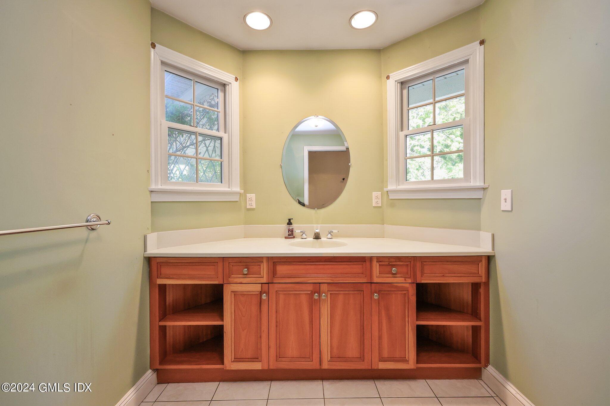 6 Center Road Old Greenwich, CT 06870 - Photo 12 of 47 a bathroom with a sink and a mirror