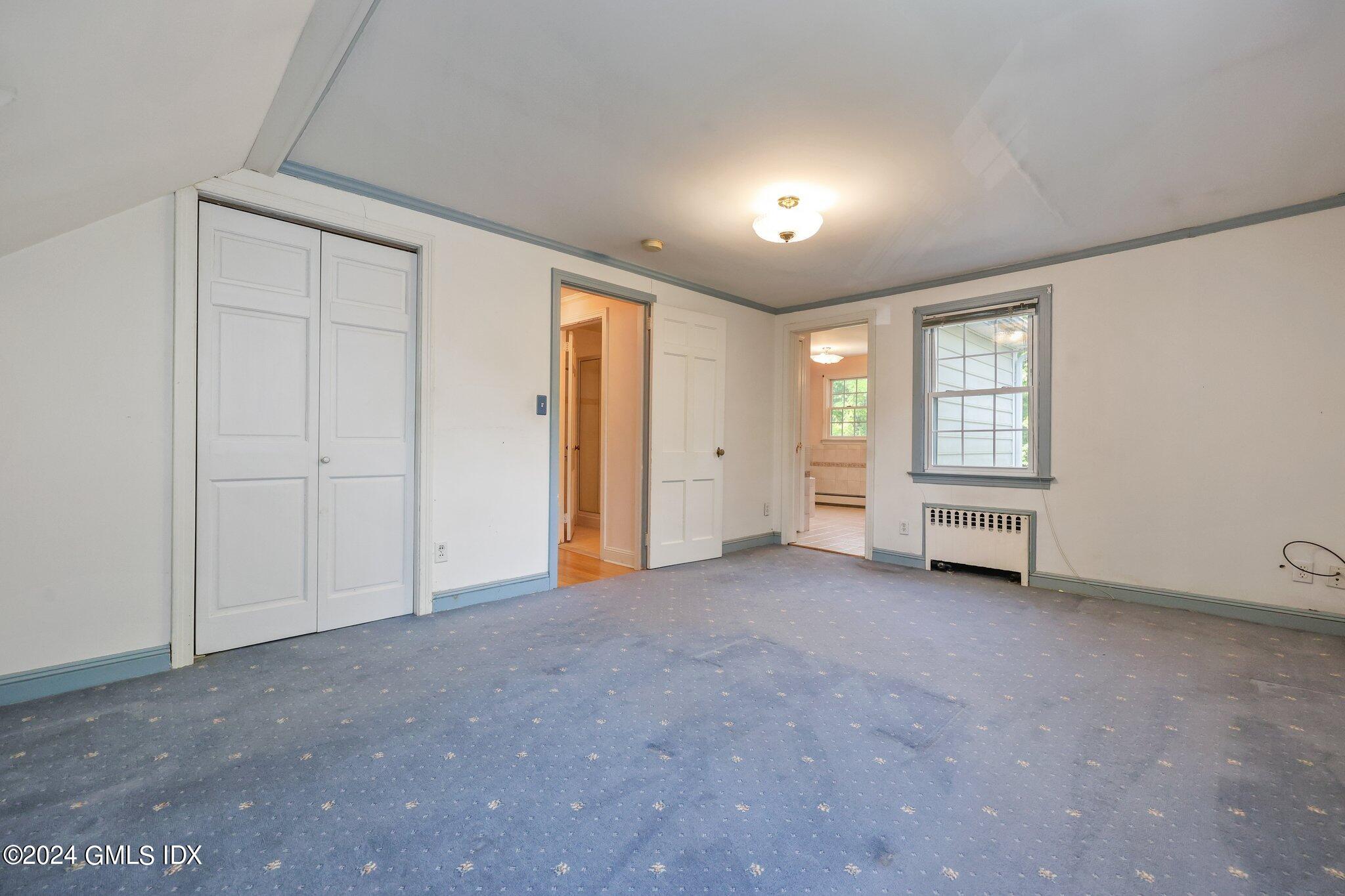6 Center Road Old Greenwich, CT 06870 - Photo 23 of 47 an empty room with windows and closet
