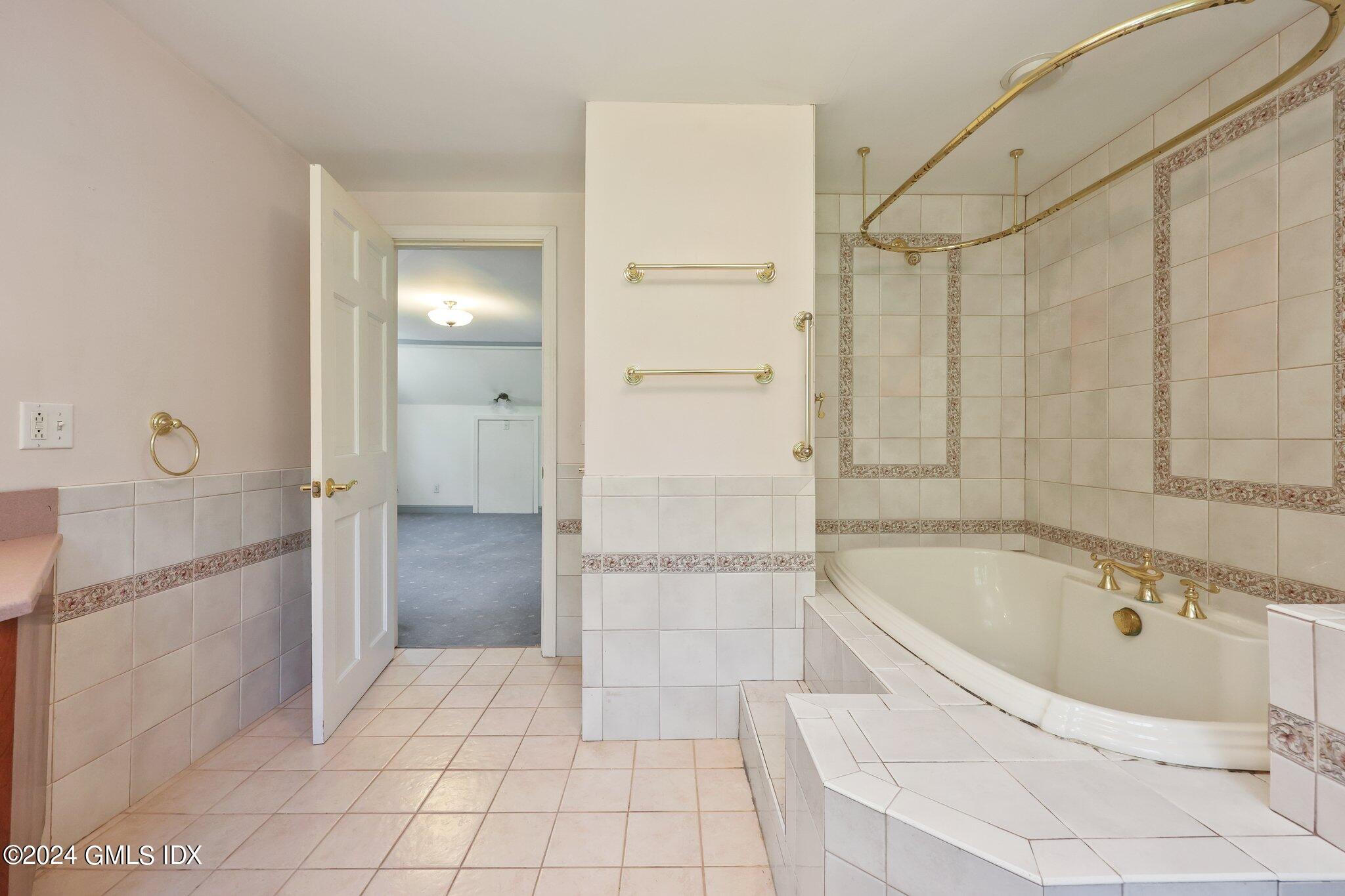 6 Center Road Old Greenwich, CT 06870 - Photo 26 of 47 a bathroom with a bathtub and shower