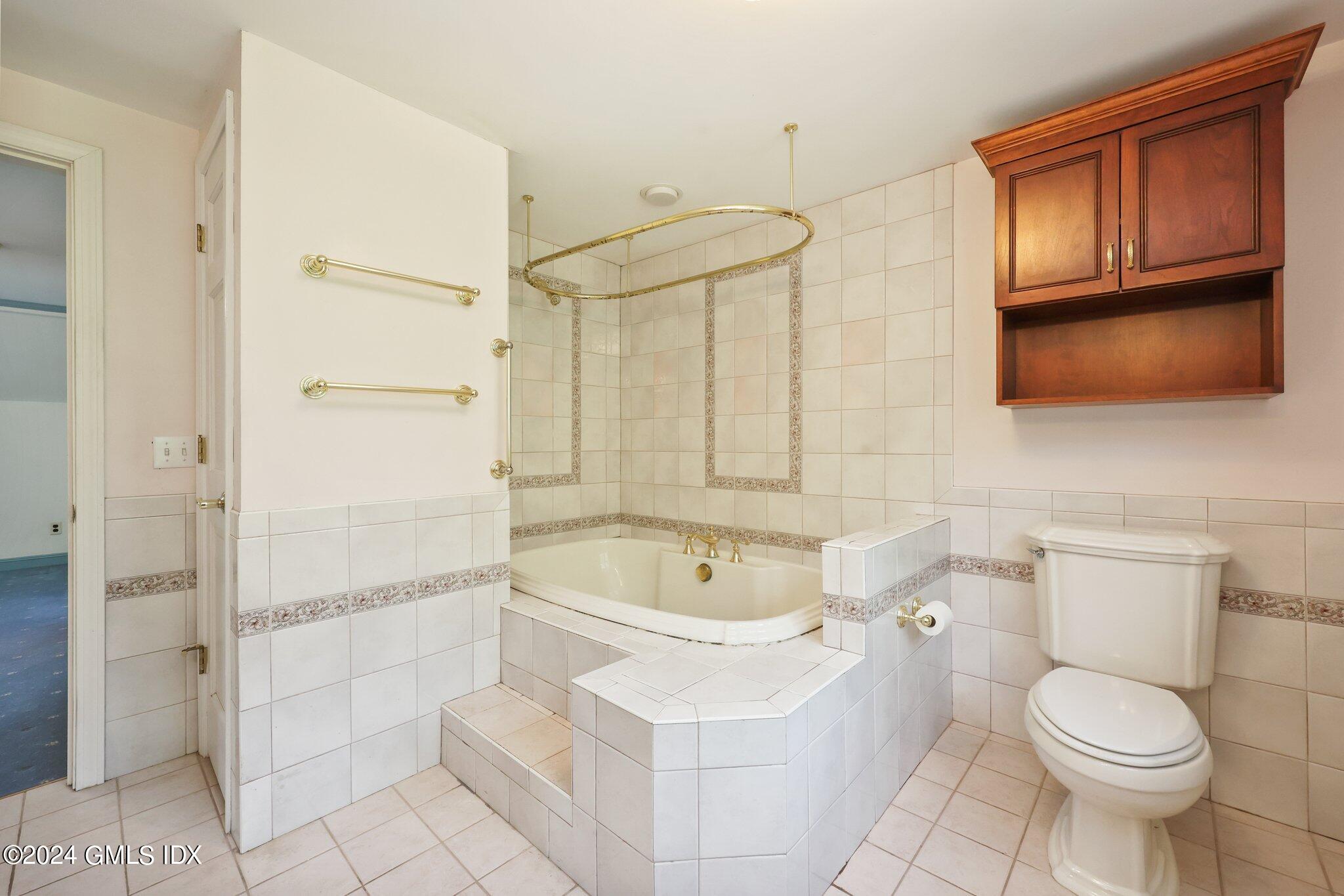 6 Center Road Old Greenwich, CT 06870 - Photo 28 of 47 a bathroom with a sink a toilet and shower