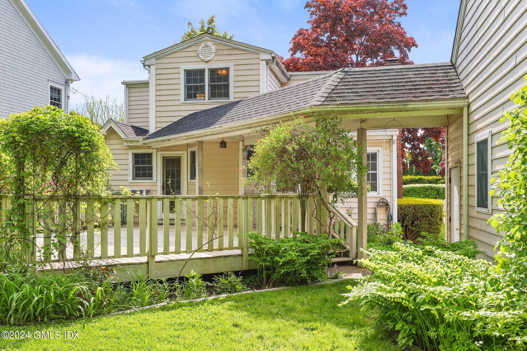 6 Center Road Old Greenwich, CT 06870 - Photo 36 of 47 a front view of a house with a yard