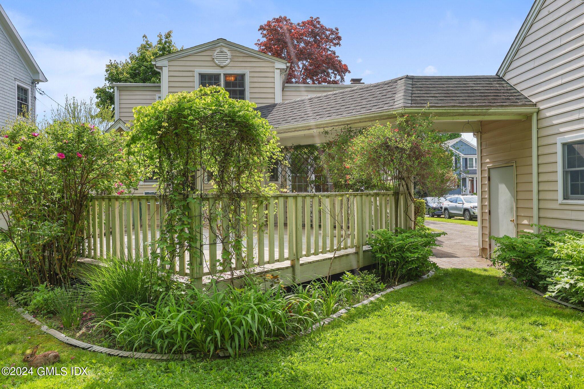 6 Center Road Old Greenwich, CT 06870 - Photo 37 of 47 a front view of a house with a yard