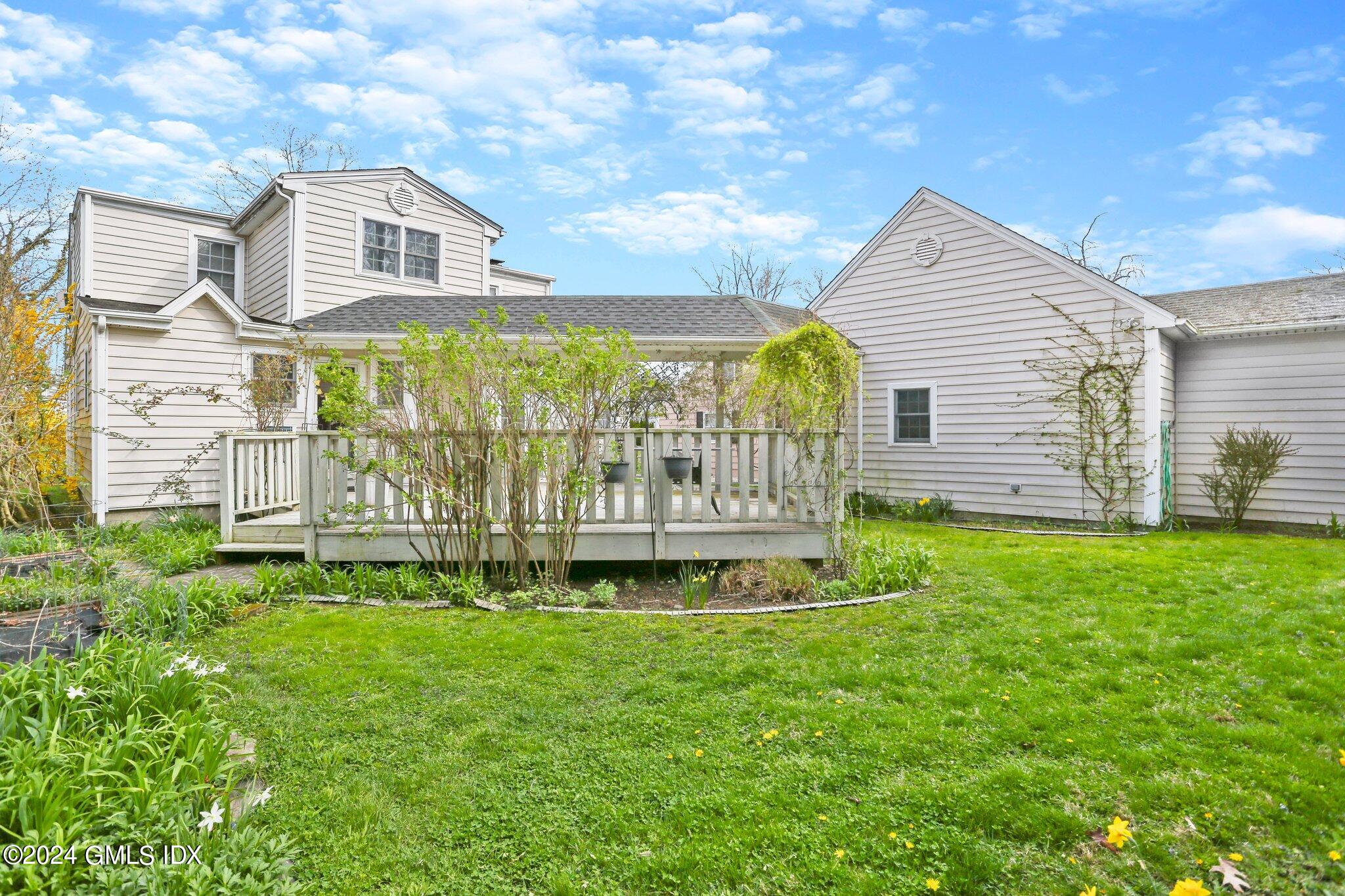 6 Center Road Old Greenwich, CT 06870 - Photo 43 of 47 a front view of a house with garden