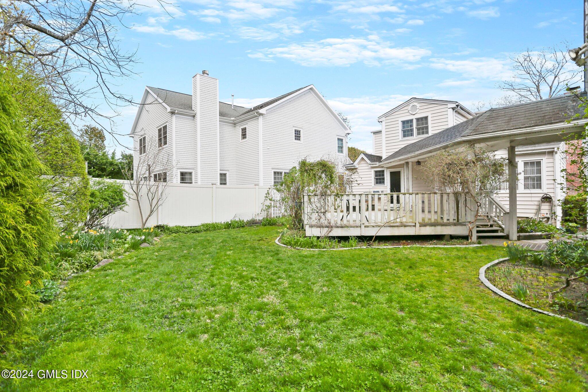 6 Center Road Old Greenwich, CT 06870 - Photo 44 of 47 a front view of a house with garden