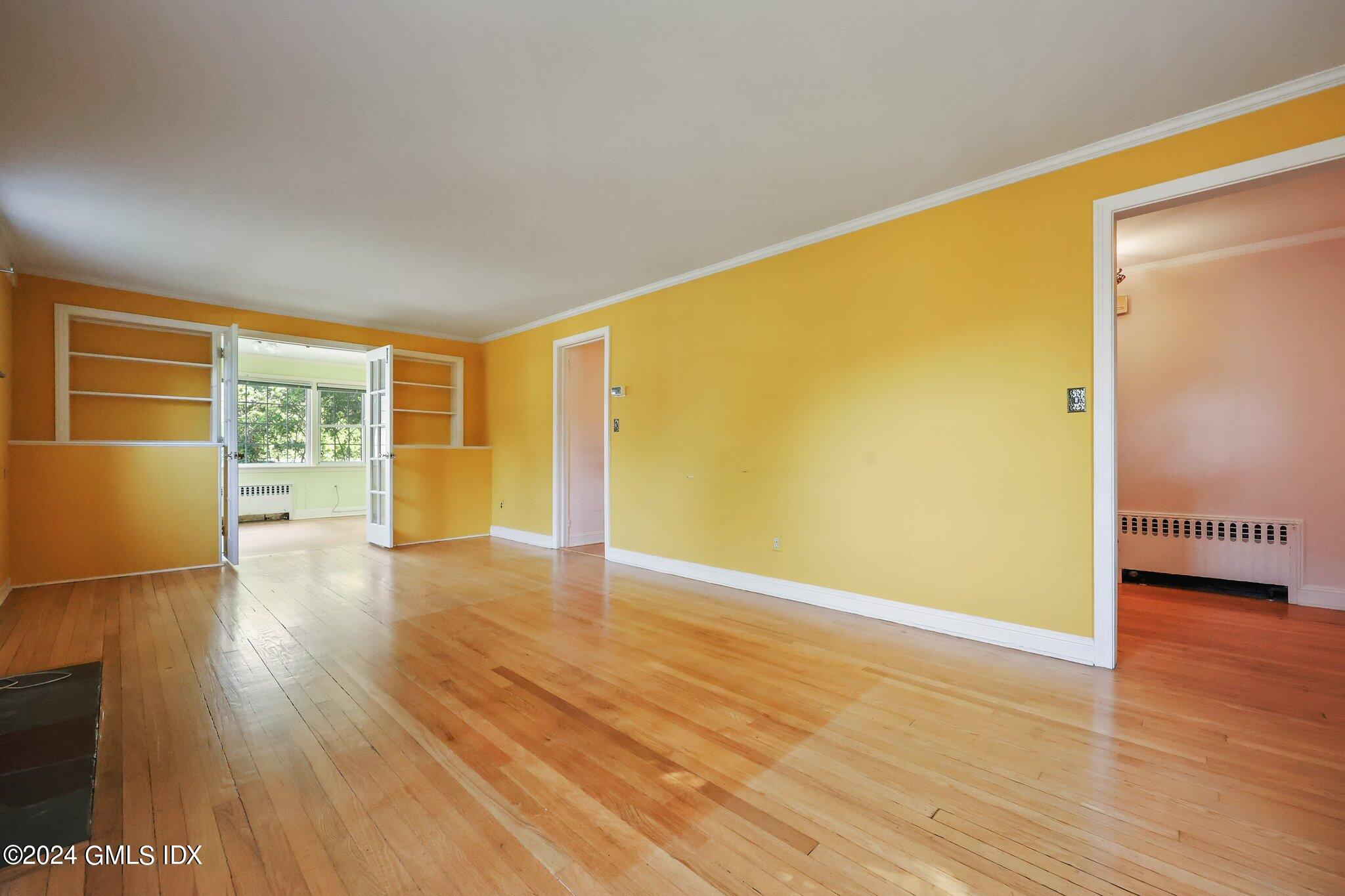 6 Center Road Old Greenwich, CT 06870 - Photo 7 of 47 a view of an empty room with wooden floor and a window