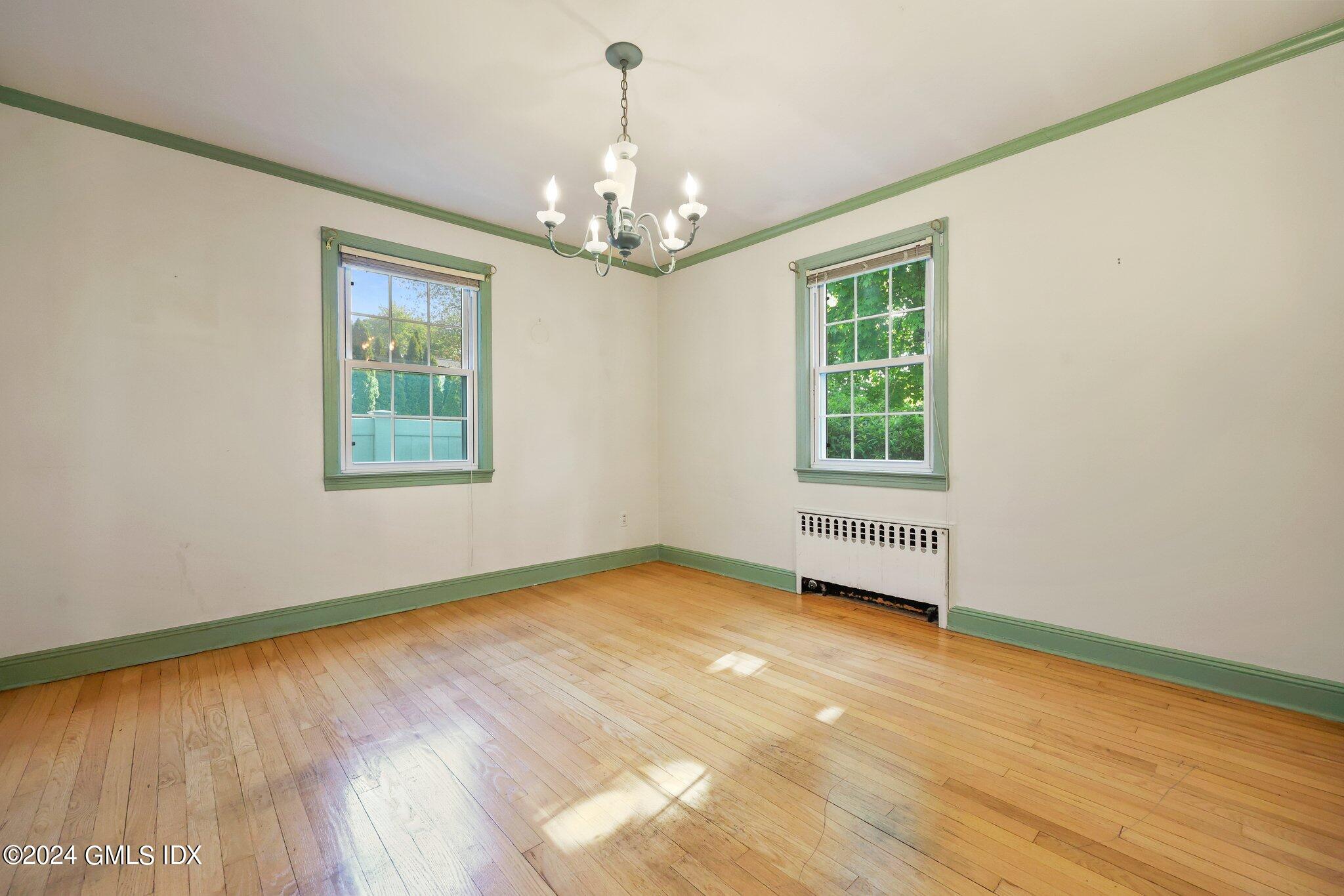 6 Center Road Old Greenwich, CT 06870 - Photo 9 of 47 a view of an empty room with wooden floor and a window