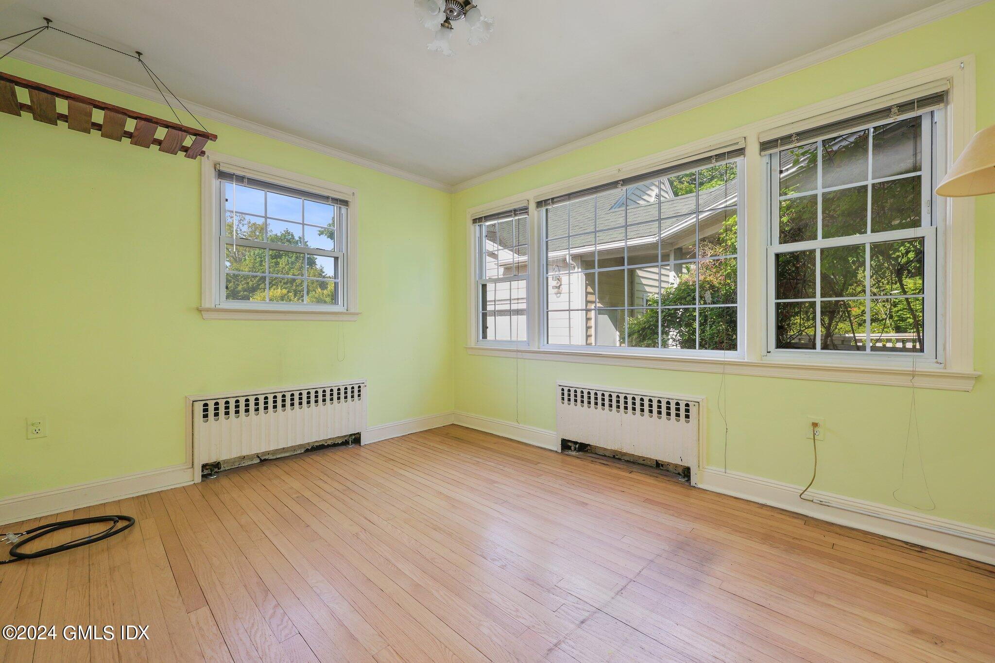 6 Center Road Old Greenwich, CT 06870 - Photo 10 of 47 wooden floor in an empty room with a window