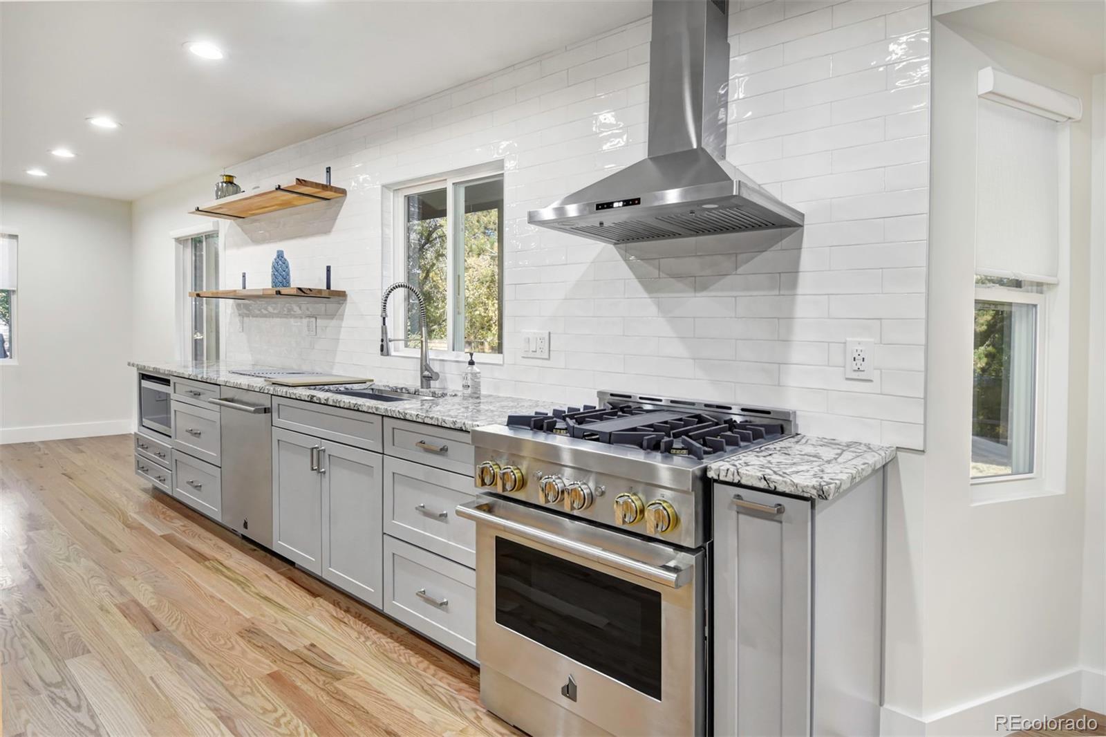6107 Old Brompton Road Boulder, CO 80301 - Photo 12 of 40 a stove top oven sitting inside of a kitchen