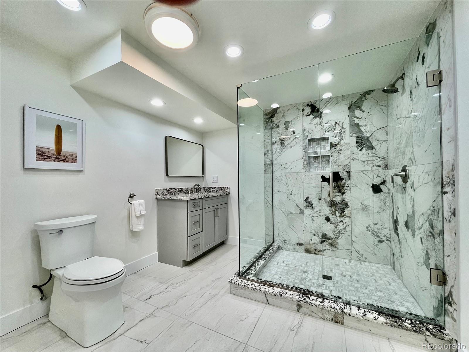 6107 Old Brompton Road Boulder, CO 80301 - Photo 26 of 40 a bathroom with a toilet sink and shower