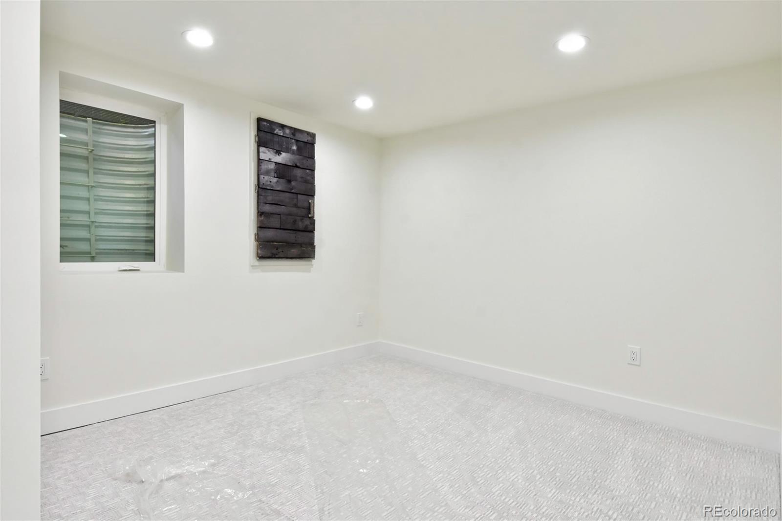 6107 Old Brompton Road Boulder, CO 80301 - Photo 27 of 40 an empty room with windows