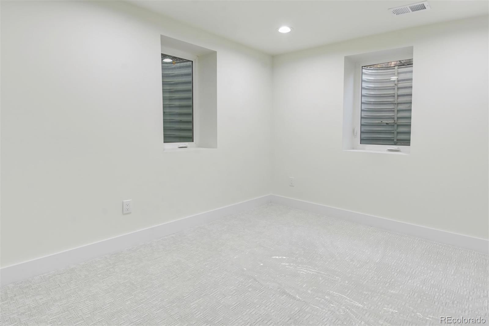 6107 Old Brompton Road Boulder, CO 80301 - Photo 28 of 40 an empty room with windows