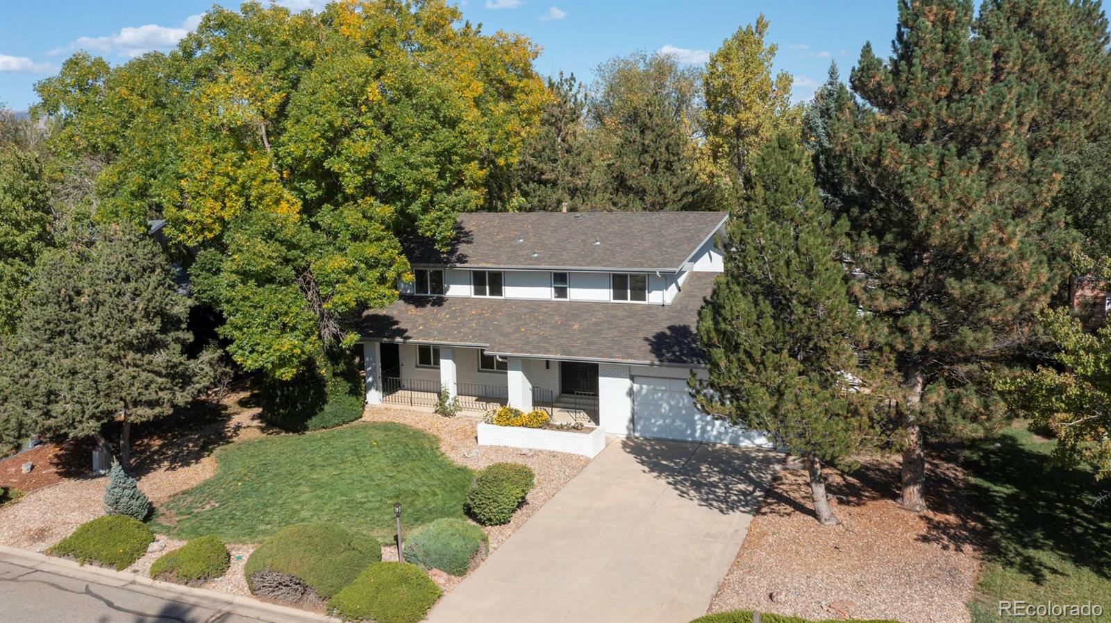 6107 Old Brompton Road Boulder, CO 80301 - Photo 35 of 40 a aerial view of a house with a yard table and chairs