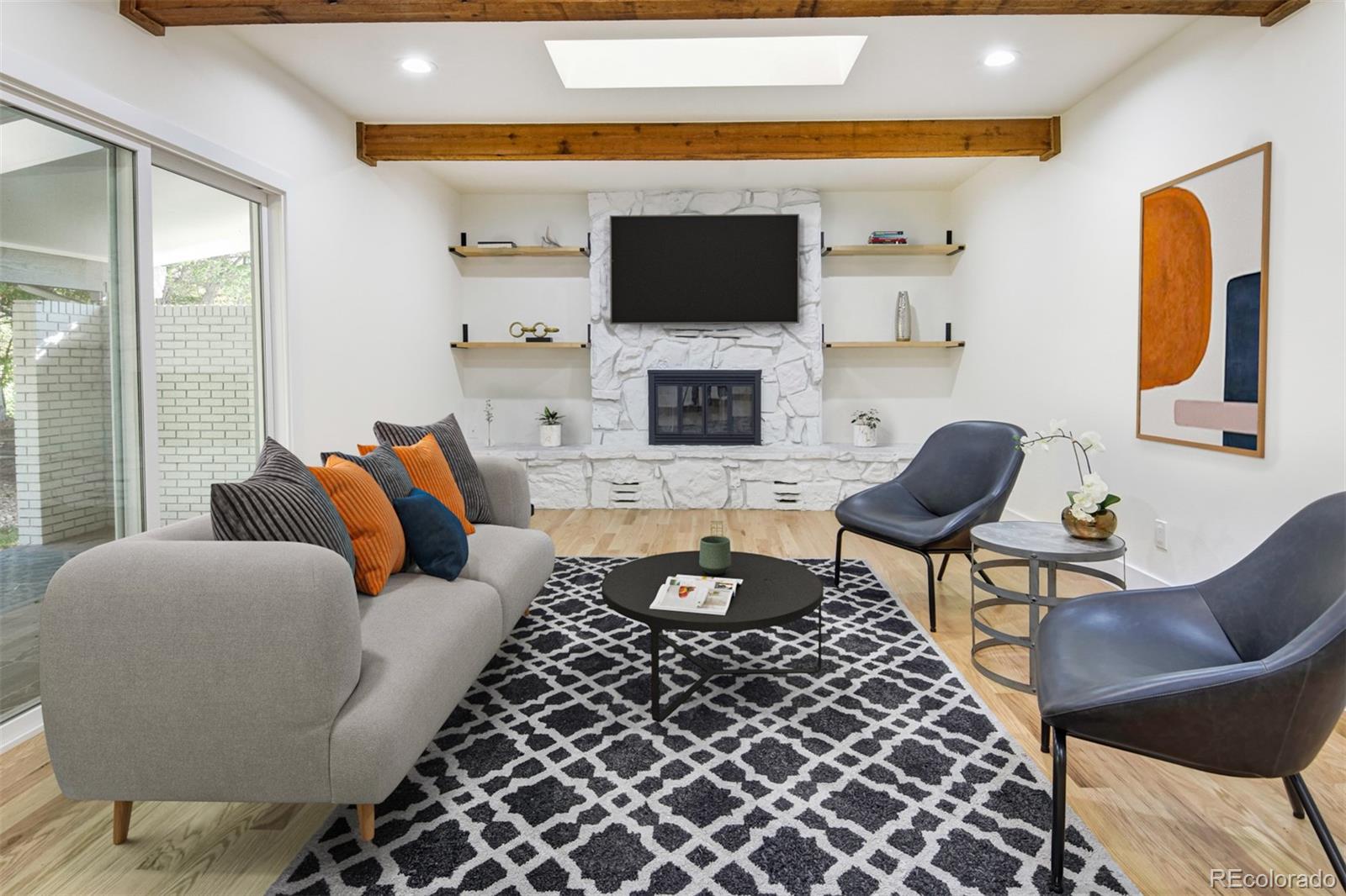 6107 Old Brompton Road Boulder, CO 80301 - Photo 4 of 40 a living room with furniture a flat screen tv and a fireplace