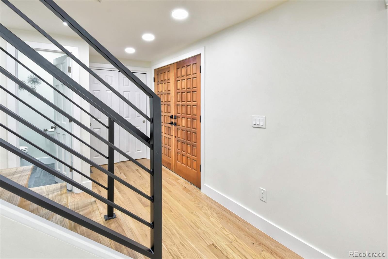 6107 Old Brompton Road Boulder, CO 80301 - Photo 7 of 40 a view of entryway with wooden floor