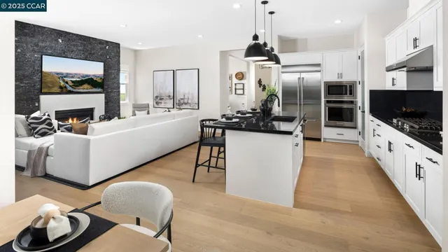 a large white kitchen with a large window
