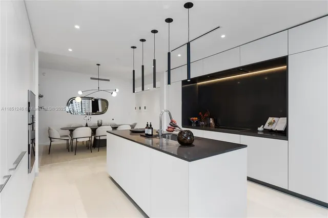a balcony with furniture and a potted plant