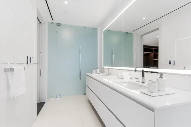 a view of a kitchen with a sink and microwave