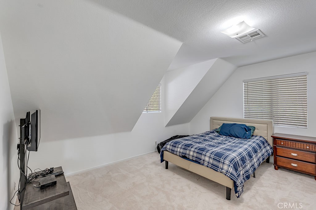318 Old Toll Road Lake Arrowhead, CA 92352 - Photo 10 of 44 a bedroom with a bed and window