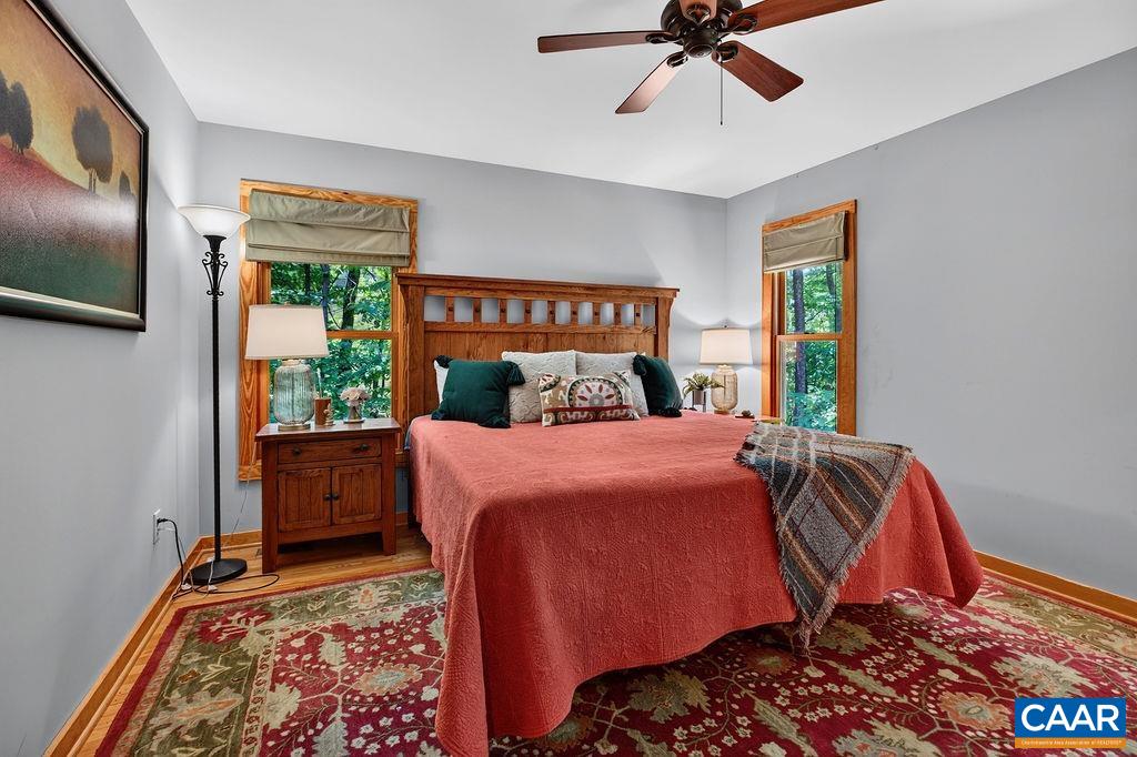 1300 Blue Ridge Drive Roseland, VA 22967 - Photo 28 of 48 The primary suite is conveniently located on the main level and features a beautifully appointed bathroom and a walk-in closet.