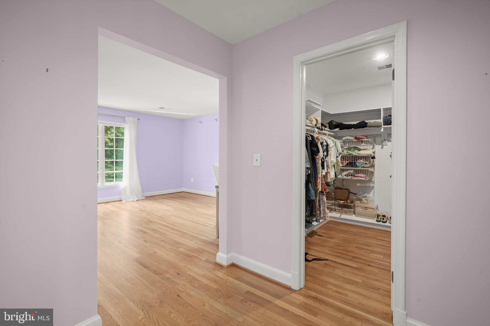 9809 Hall Road Potomac, MD 20854 - Photo 26 of 60 an empty room with wooden floor mirror and windows