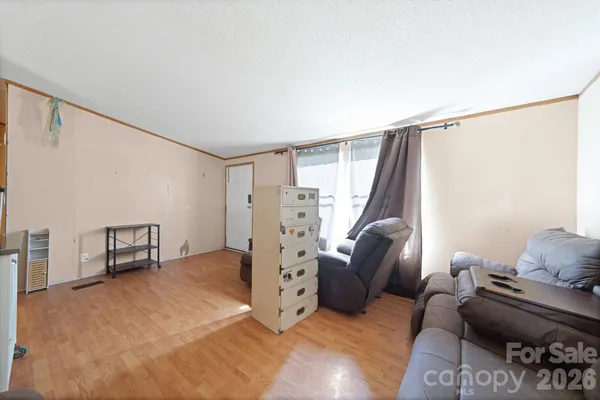 a view of a livingroom with furniture and a rug