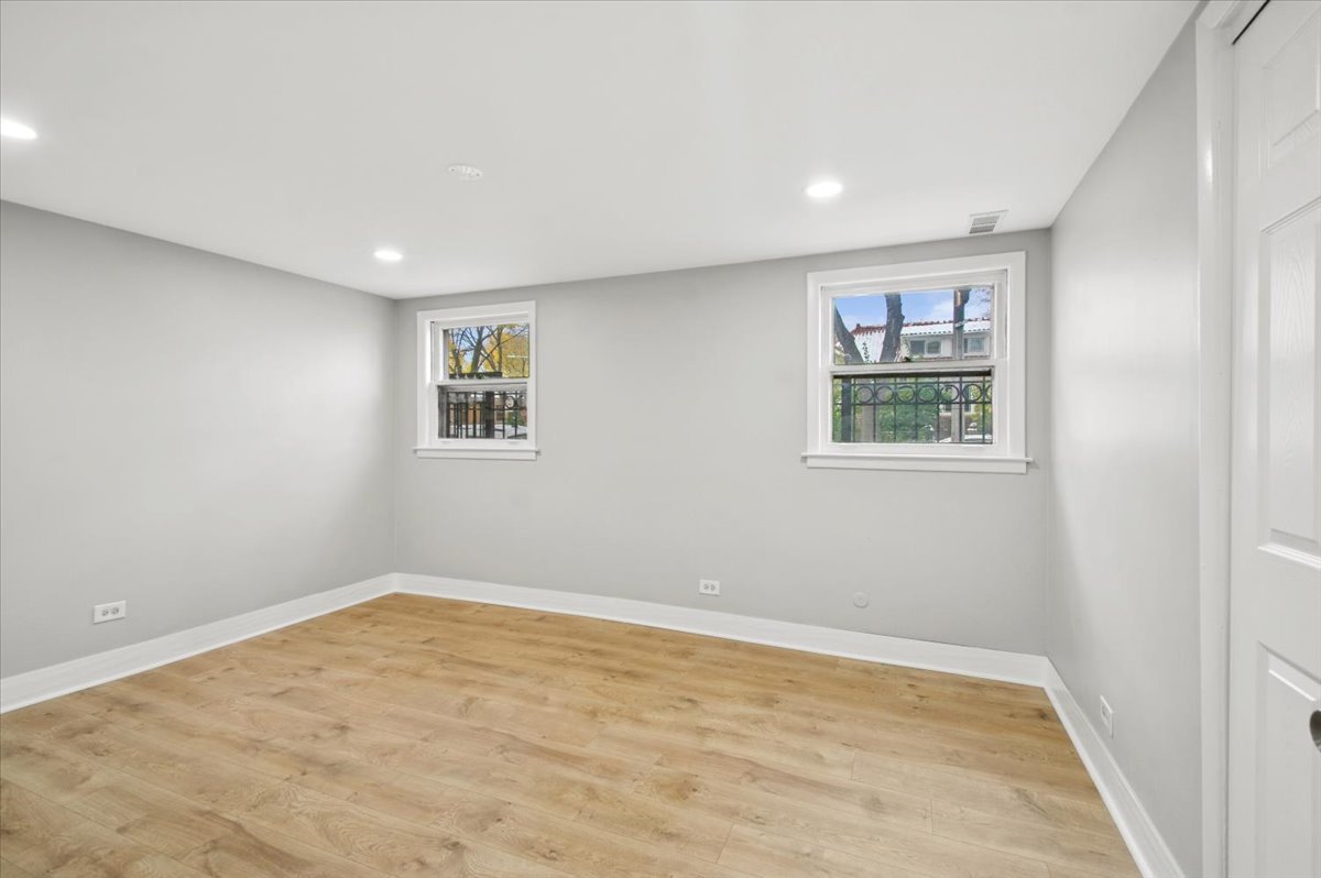 2623 West Arthur Avenue, Unit 1 Chicago, IL 60645 - Photo 11 of 11 a view of room with window and ceiling fan